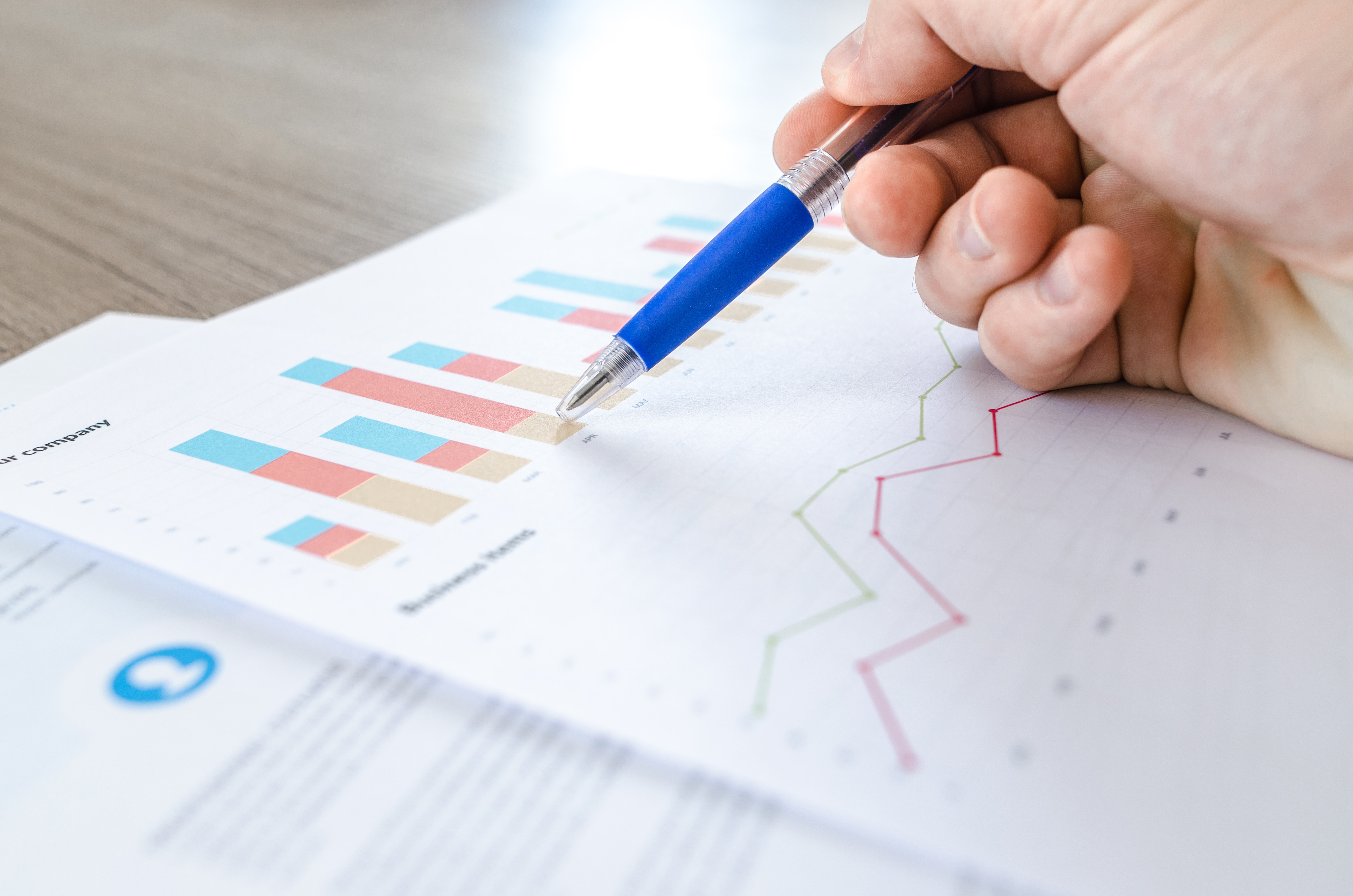 Research graphs being reviewed by a person
