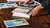 People organising books on table