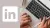 image of laptop user next to a white LinkedIn logo