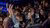 Members of the audience raising their hands 