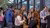 Attendees networking with speaker