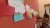 Woman putting post its on wall, brainstorming session
