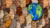 Cutout of the globe surrounded with different people
