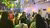 Guests gathered in lit courtyard under hanging bulbs and leafy canopy