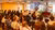 Teacher addressing seated audience in a classroom