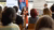 woman presenting to seated audience